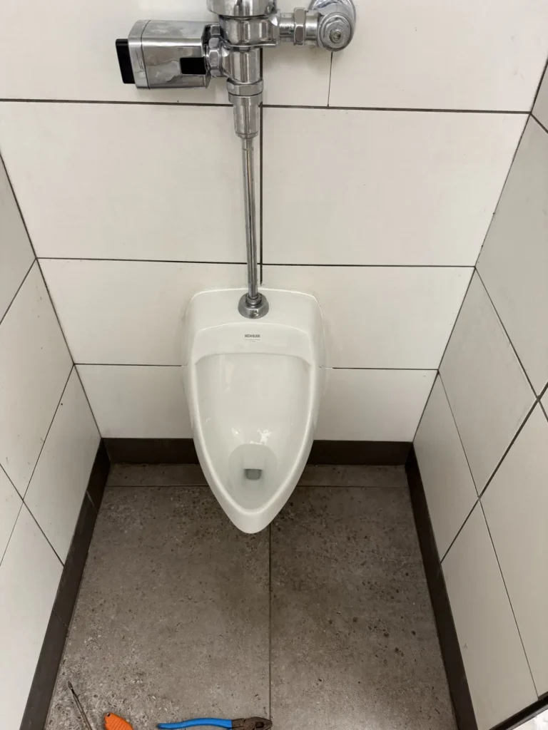 Urinal installed by NBR Plumbing in a commercial building